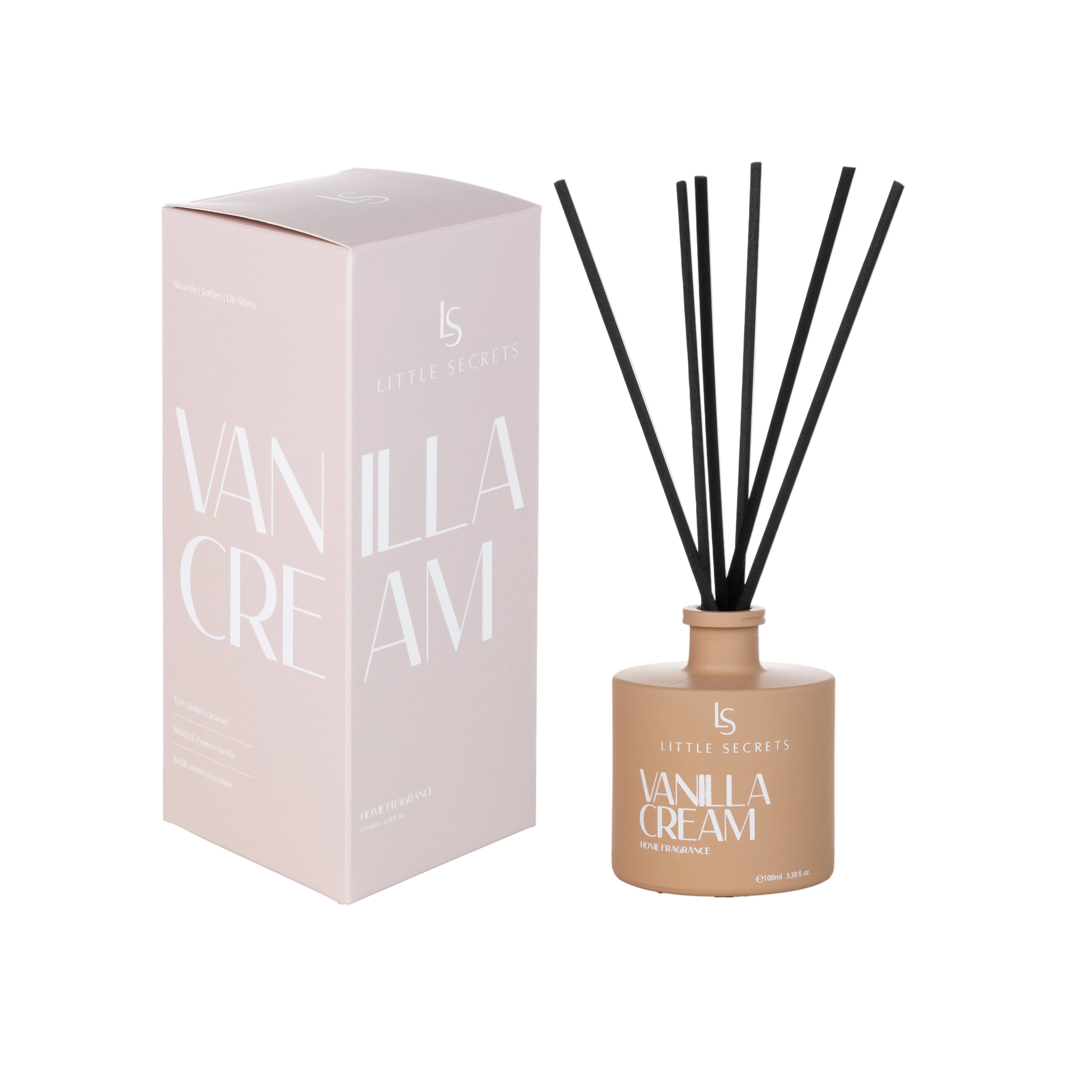 Little Secrets Vanilla Cream reed diffuser with a beige bottle, black reeds, and a matching pale pink box on a white background.