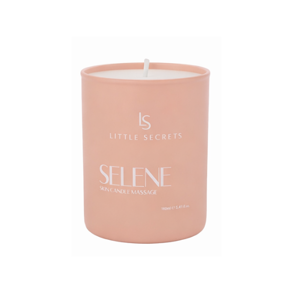 A single-wick soy candle in a matte dusty pink container with white text reading 'Little Secrets' and 'Selene Skin Candle Massage' on a plain white background.