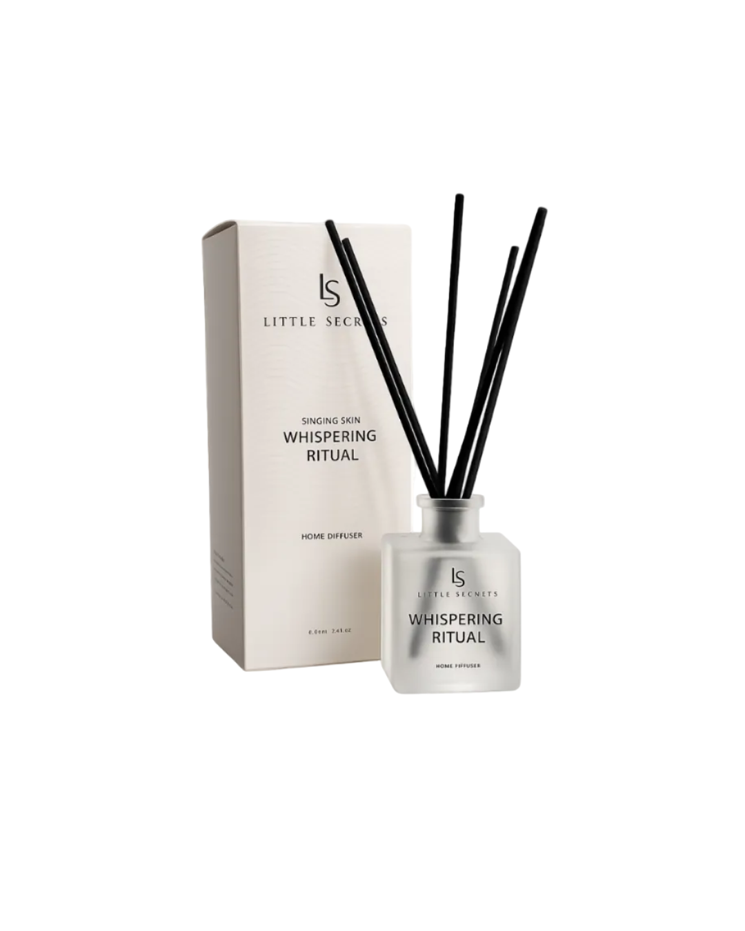 Little Secrets Whispering Ritual home diffuser with a frosted glass bottle, black reeds, and its matching cream-colored packaging box on a white background.