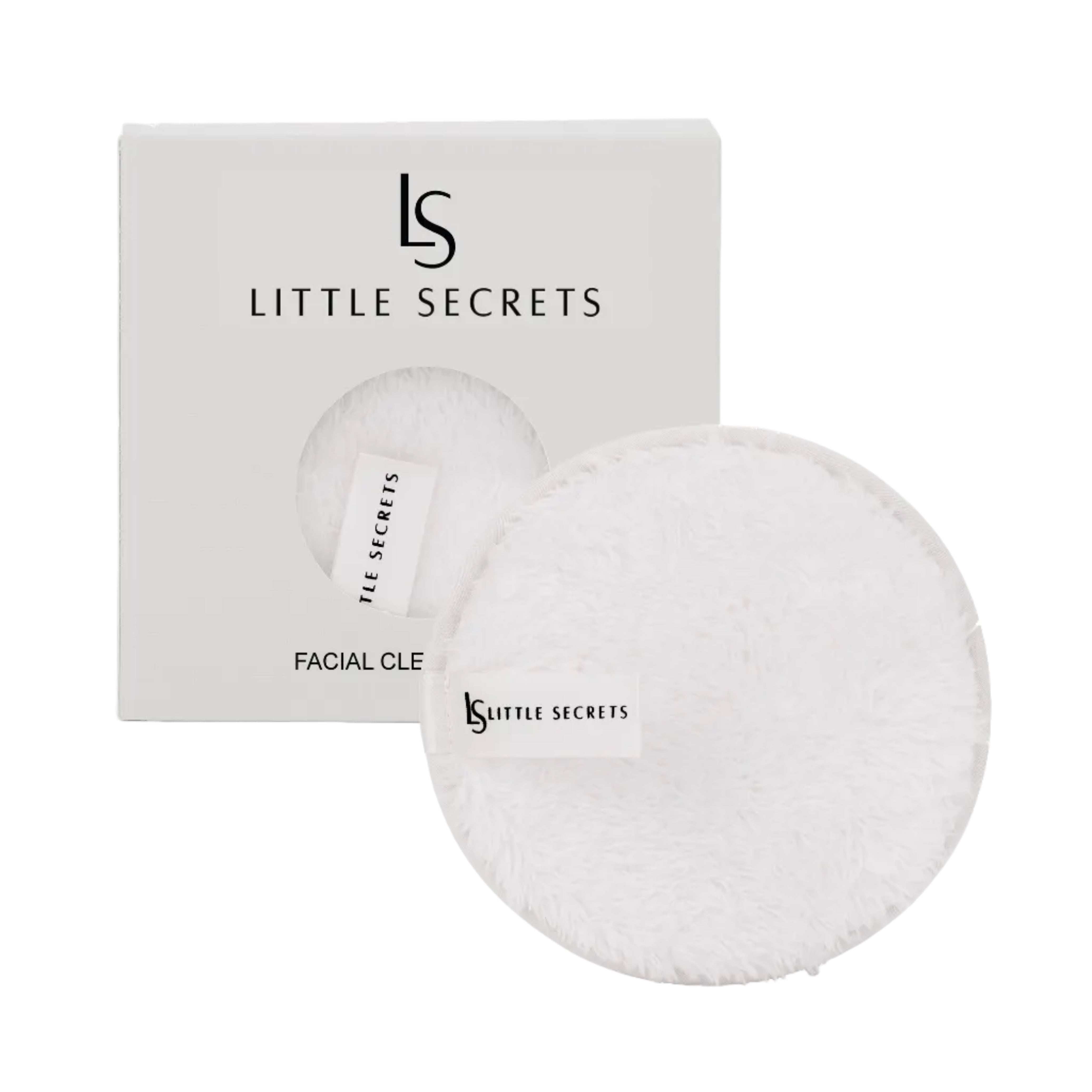 Two round white fluffy facial cleansing pads with a small white tag printed with the 'LS LITTLE SECRETS' logo, shown in front of their white packaging box.